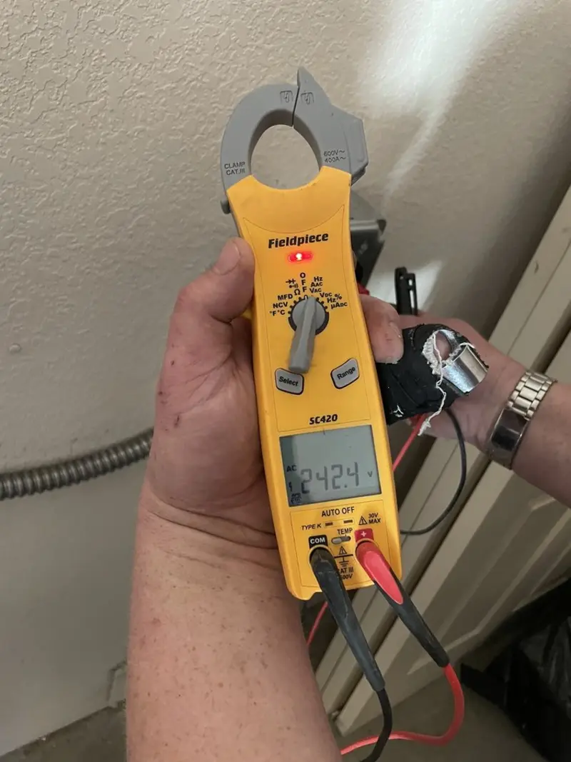 Voltage testing with clamp meter during Electrical Installation Services in Lansford